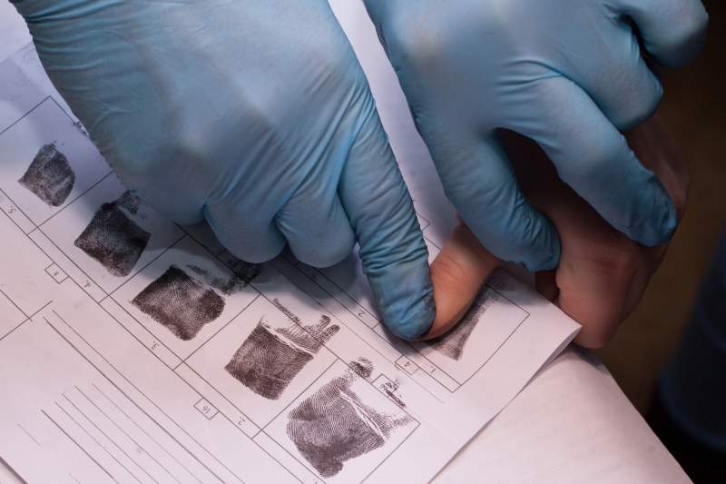 immigration services collect someone’s fingerprints