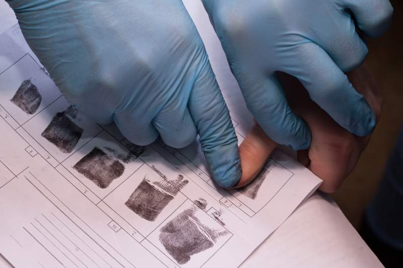 immigration services collect someone’s fingerprints