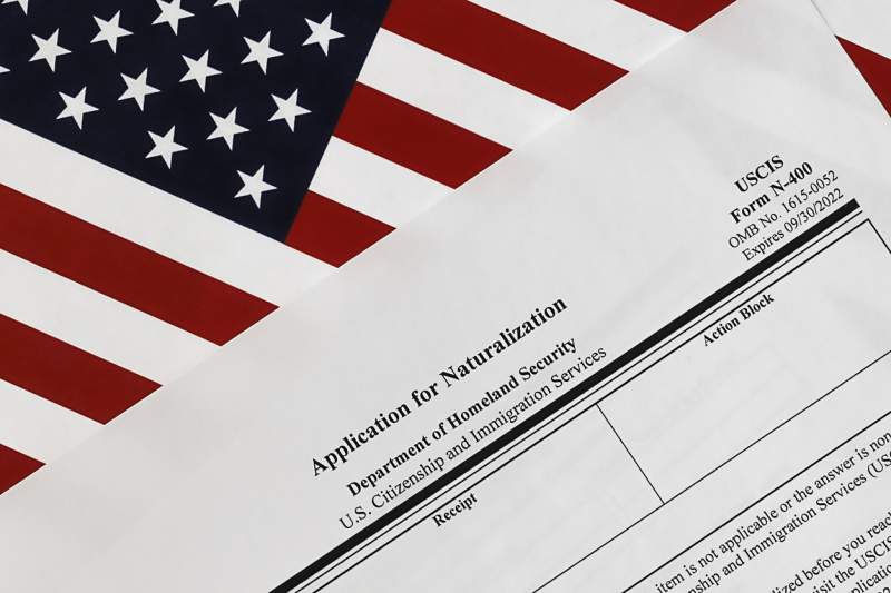 application for naturalization on top of american flag