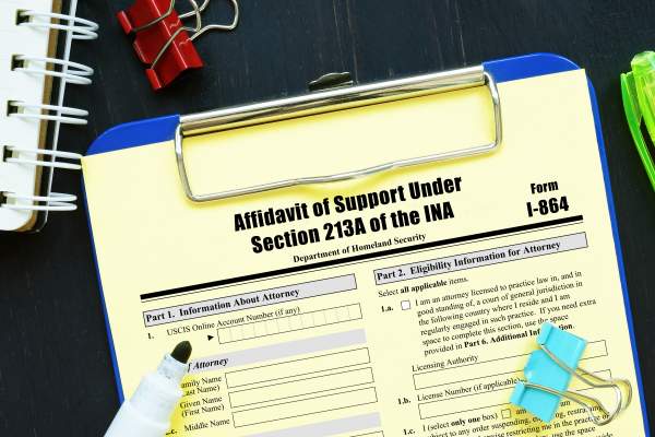 clipboard with form i-864 affidavit of support under section 213a of ina