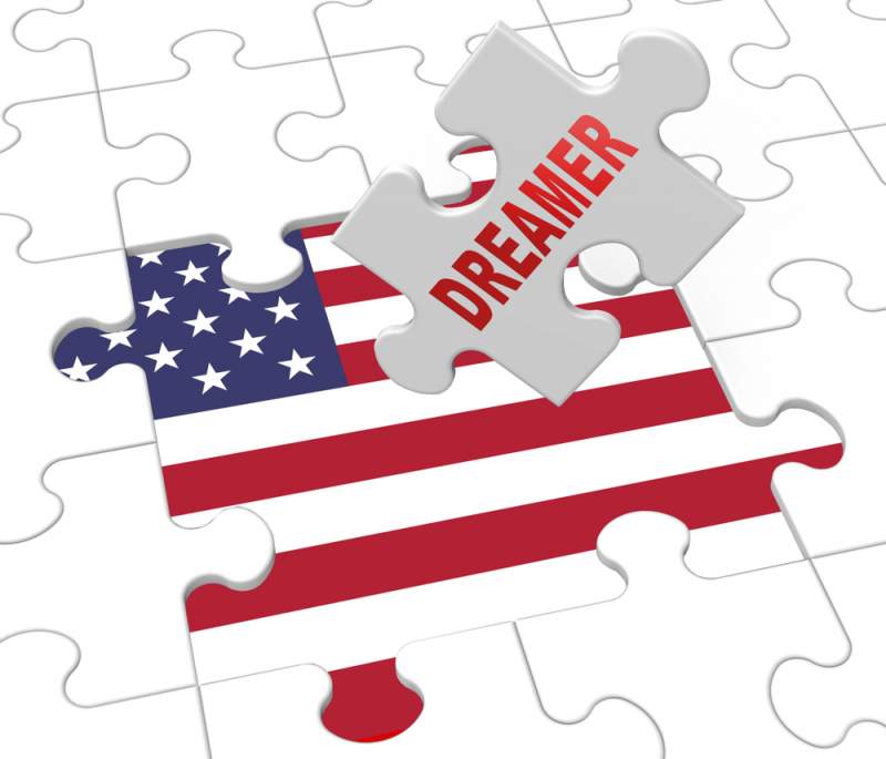 dreamer puzzle piece over american flag