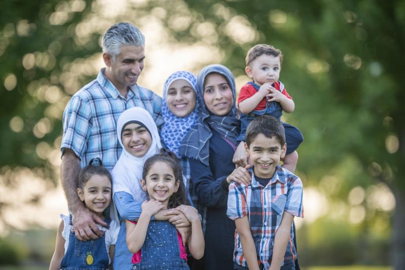 family portrait of happy immigrants