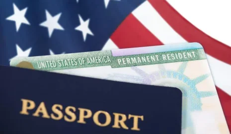green card passport and American flag