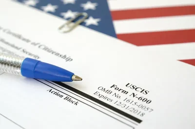 uscis-form-n-600-with-pen-and-american-flag